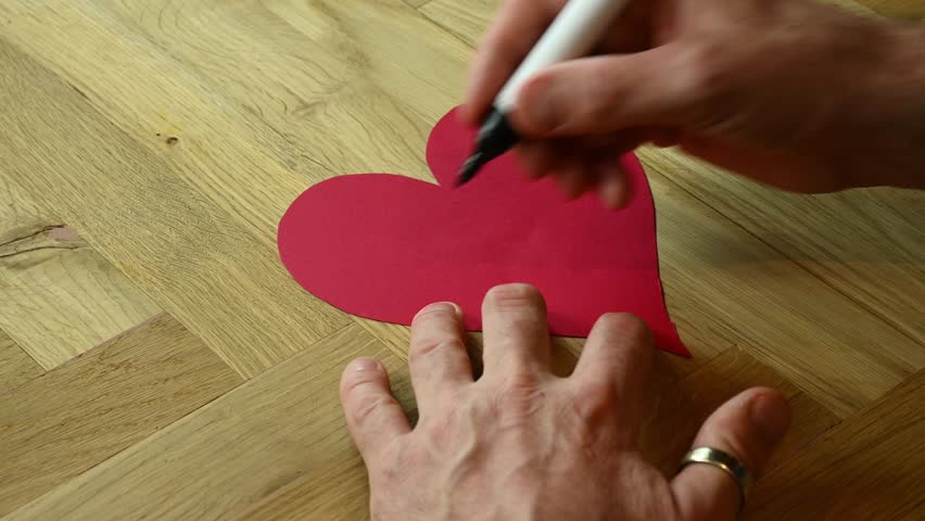 romantic heart shape red plain valentines day card with I love you message handwritten as a gift to show love and affection for a specific person who they adore during the special day for lovers
