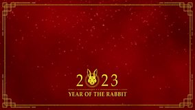 Motion graphic of Golden rabbit logo with chinese new year and year of the Rabbit 2023 on dark red background and glitter particle in a happy new year concept abstract background seamless loop video