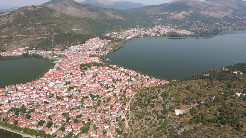 Aerial clip over a mouintain and the city and lake of Kastoria, in northern Greece