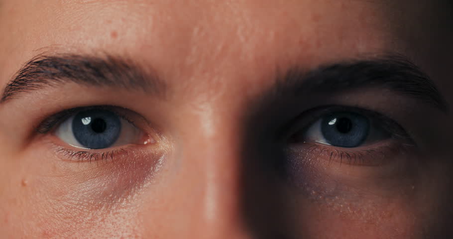 Macro close-up on beautiful blue iris eyes looking straight into the camera. Letting go of the eye. | Shutterstock HD Video #1098640075