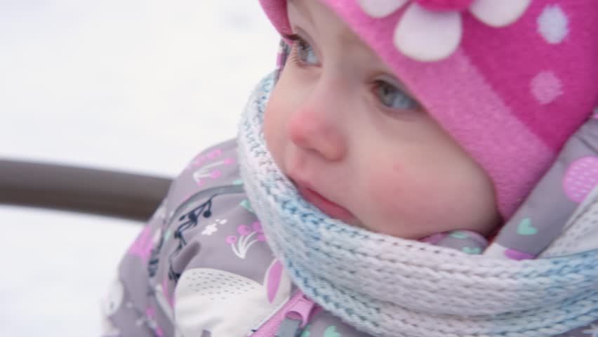 Happy Kid Having Fun on Carousel. Front View of Smiling Little Girl Enjoying an Merry-go-round Attraction. Amusement Kiddie Ride. POV Carefree Young Child Spinning at Playground Carrousel Closeup Face