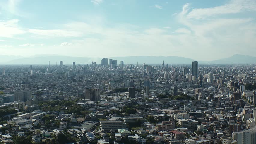 NAGOYA, JAPAN - OCTOBER 2022 : Time lapse shot of NAGOYA CITY in sunny daytime. Aerial high angle view of buildings and street traffic around Nagoya station and Sakae area (central downtown).