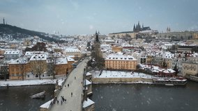 Aerial winter view of the city of Prague, Czech Republic, with snow falling - Powered by Shutterstock - Get 15% off with code: PIKWIZARD15