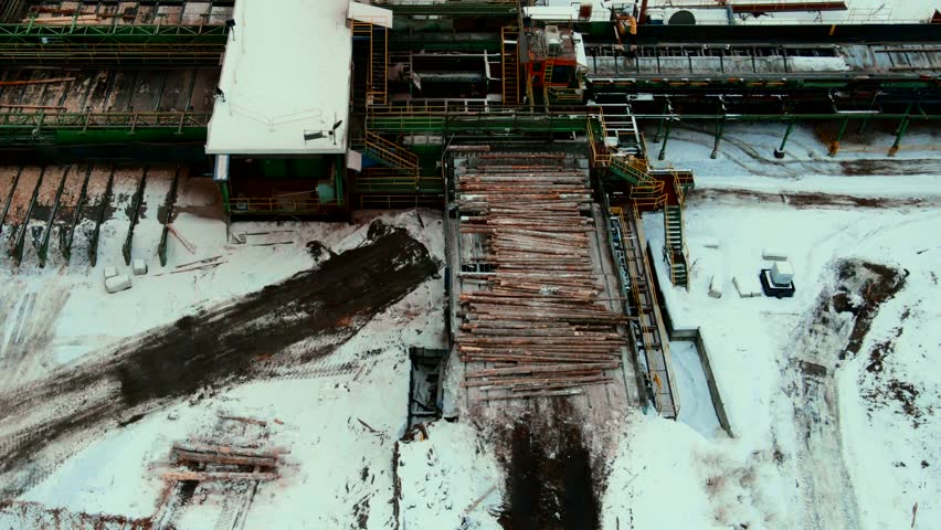 Efficient log handling with specialized machinery at sawmill during plywood production process