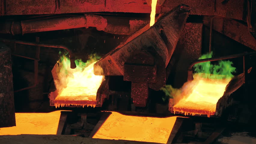 Smelter is pouring molten copper between burning molds | Shutterstock HD Video #1098651749