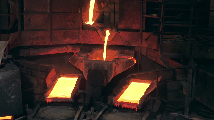Factory smelter with molten copper flowing through it | Shutterstock HD Video #1098651919