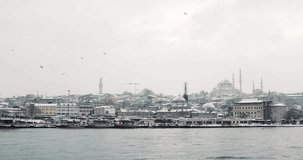 Snowy day in istanbul, Turkey. Snowy winter time view of Eminonu District and Suleymaniye Mosque in the city of Istanbul, Turkey. 4K footage