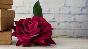 stack of gift box and rose flower on table  - Powered by Shutterstock - Get 15% off with code: PIKWIZARD15