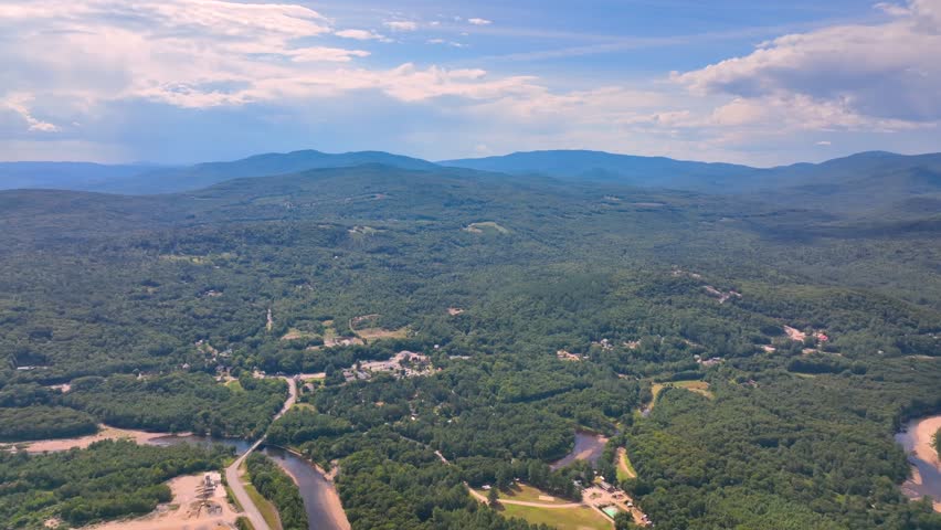 Aerial view of Campton Mountain, Pemigewasset River and Interstate Highway I-93 in summer with White Mountain National Forest at the background in town of Campton, New Hampshire NH, USA. 