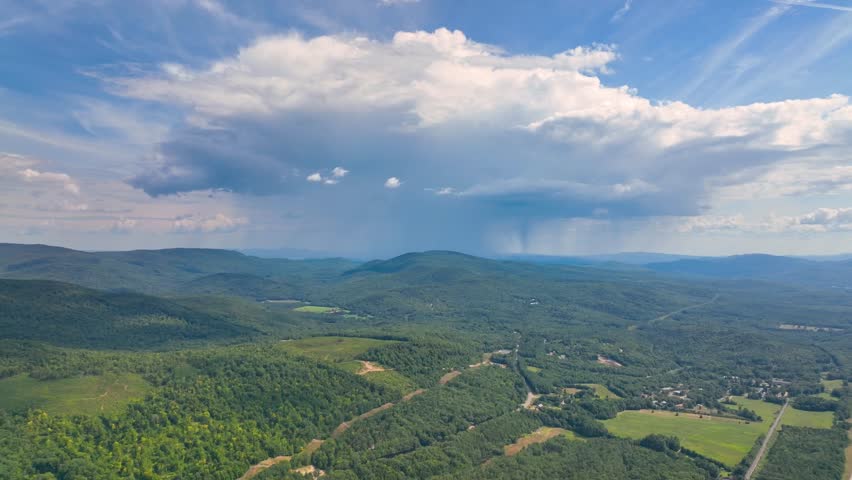 Aerial view of Raining cloud over the Campton Mountain in summer with White Mountain National Forest at the background in town of Campton, New Hampshire NH, USA. 