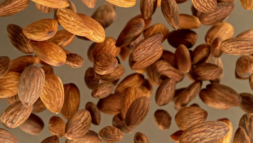 Super slow motion of rotating almonds up to the air. Filmed on high speed cinema camera, 1000fps, placed on high speed cine bot. | Shutterstock HD Video #1098662623