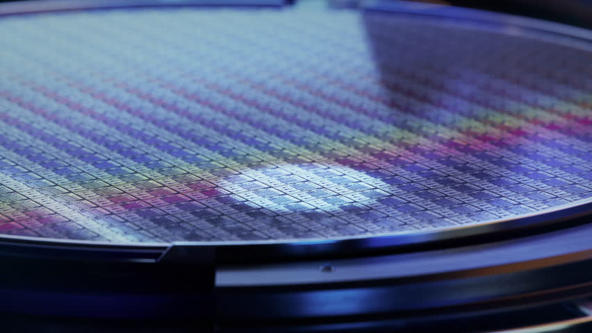 Macro Shot of Silicon Wafer during Photolithography Process. Shot of Lithography Process that allows to Create Complex Patterns during Semiconductor and Computer Chip Manufacturing at Fab or Foundry. Royalty-Free Stock Footage #1098663779