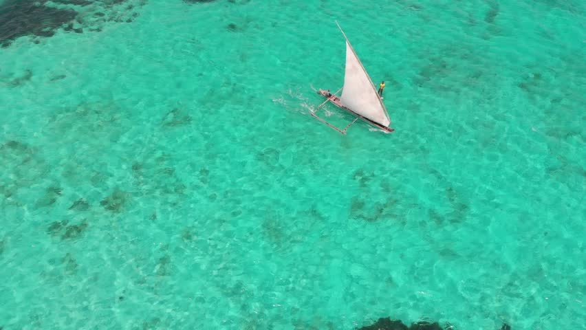 Small sailing boat off the coast of Zanzibar Royalty-Free Stock Footage #1098669089