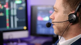 Chatting man in techical support wearing a headset in a trading broker office - Powered by Shutterstock - Get 15% off with code: PIKWIZARD15