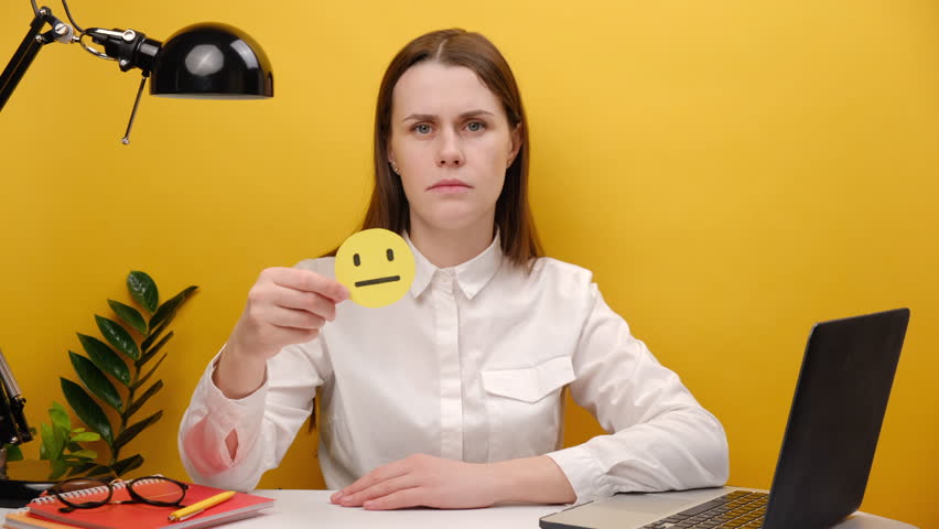 Portrait of employee business woman in shirt sit work at office desk pc laptop holding sad face, bad emoticon, posing isolated over yellow color background wall in studio. Achievement career concept | Shutterstock HD Video #1098672283