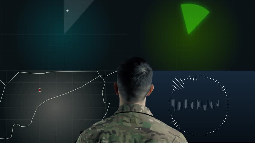 Military headquarters. Analytical Center for Military Operations. A military soldier in uniform is watching the Montiors. Combat analysis. Innovative technologies in the army.