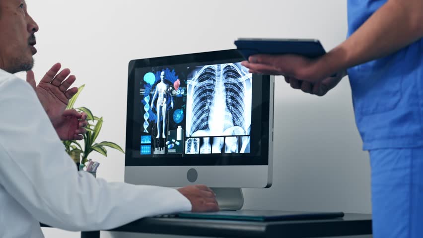 A group of medical staff having a meeting while looking at a PC screen.　Teamwork of business. | Shutterstock HD Video #1098674177