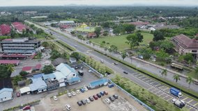 Drone view of yellow mosque building and cityscapes in Rompin Pahang, Malaysia
