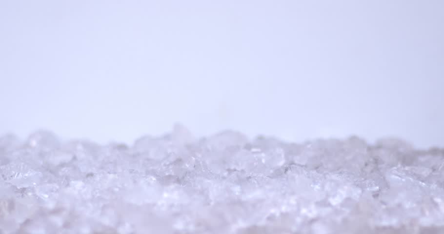 Slow motion of ice cubs filling in sliced pears, fresh fruits for juicy, cold, white food for summer time. Filmed on high speed cinema camera, 8K downscale, 4K.