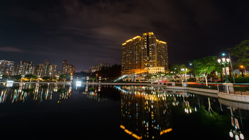 Timelapse of buildings by the river in Macau.