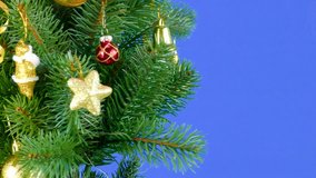 Christmas tree and Christmas decorations chroma key rotate on a blue background