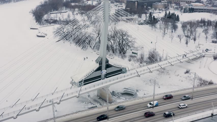 Walking bridge in winter over the red river. The forks. Winnipeg, Manitoba.