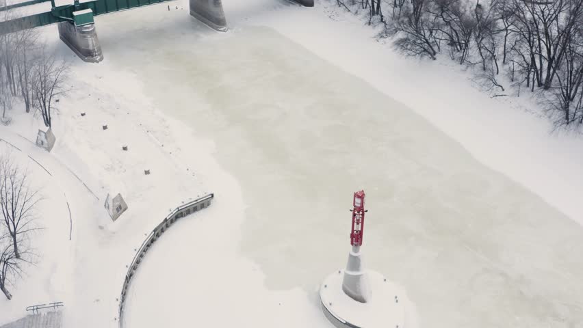 Aerial tilt up over two joining rivers to reveal the city of Winnipeg Manitoba during an ice storm.
Canada.