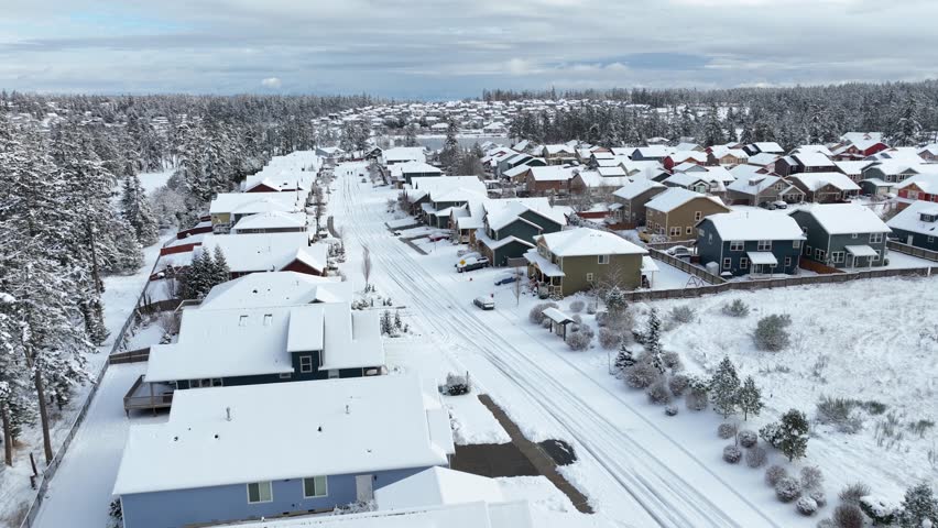Drone shot of snow covering a middle class community in Washington State.