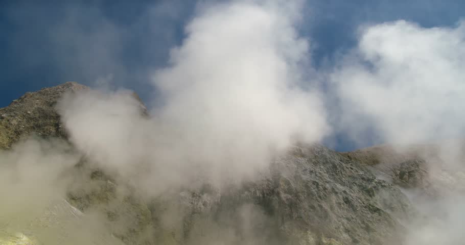 Hot steam smoke rising from sulfur vent fumerole on White Island