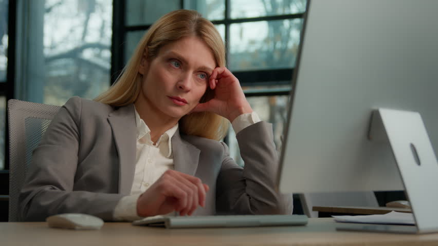 Tired lazy adult middle-aged woman female manager employee worker bored at work project online in computer in office Caucasian mature ill businesswoman need energy asleep feel overworked exhaustion | Shutterstock HD Video #1098682761