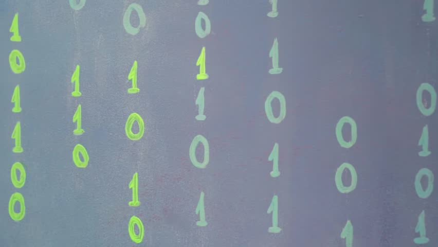 Close-up of a feminine hand with a beautiful manicure, draws on the blue wall.