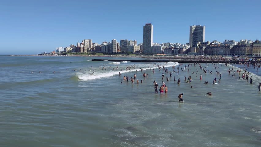Crowded Public Beach in Summer People enjoying Sun and Sea Water in Mar del Plata, Buenos Aires province, Argentina. Slow Motion.
