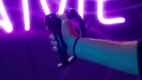 Cyber gamer in VR glasses plays virtual reality game in neon futuristic space. Cyberpunk fashion gaming concept. Man and woman play metaverse virtual digital technology game control with VR goggle. - Powered by Shutterstock - Get 15% off with code: PIKWIZARD15