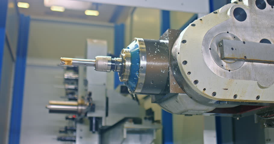 CNC machine in industrial workshop, automated process of changing nozzle, closeup view, 4K, Prores | Shutterstock HD Video #1098689229