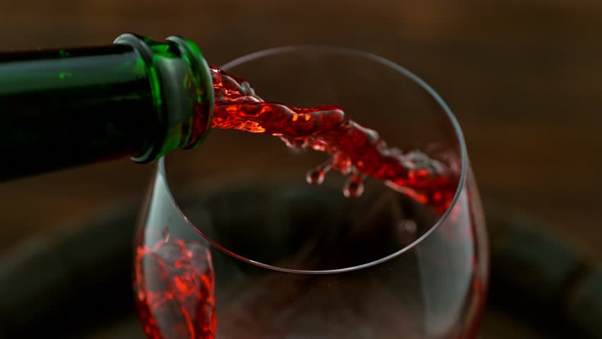 Super slow motion of pouring red wine with camera motion. Speed ramp effect. Filmed on high speed cinema camera with cinebot, 1000 fps. | Shutterstock HD Video #1098689595