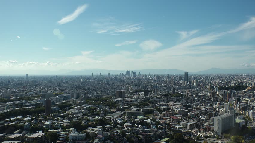 NAGOYA, JAPAN - OCTOBER 2022 : Aerial high angle view of NAGOYA CITY in sunny daytime. View of buildings and street traffic around Nagoya station and Sakae area (central downtown).