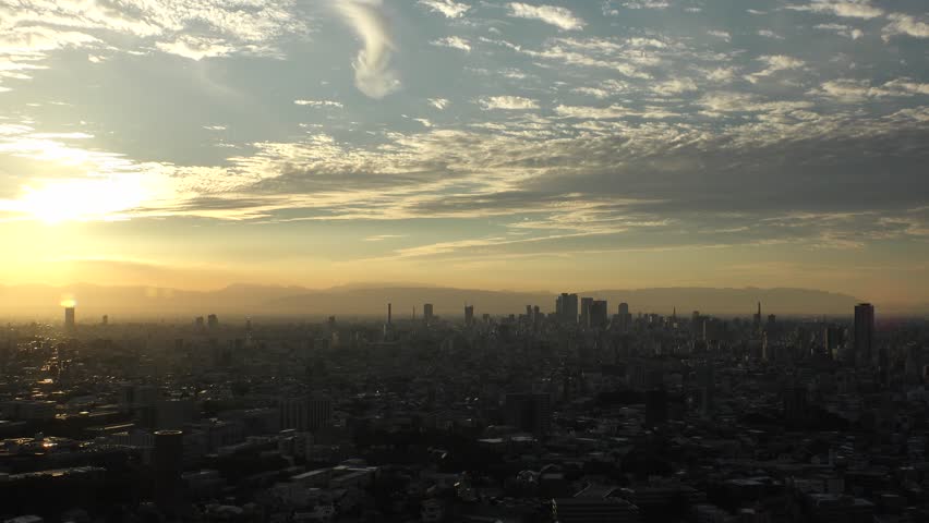 NAGOYA, JAPAN - OCTOBER 2022 : Aerial high angle view of NAGOYA CITY in sunset or sunrise. View of buildings and street traffic around Nagoya station and Sakae area (central downtown).