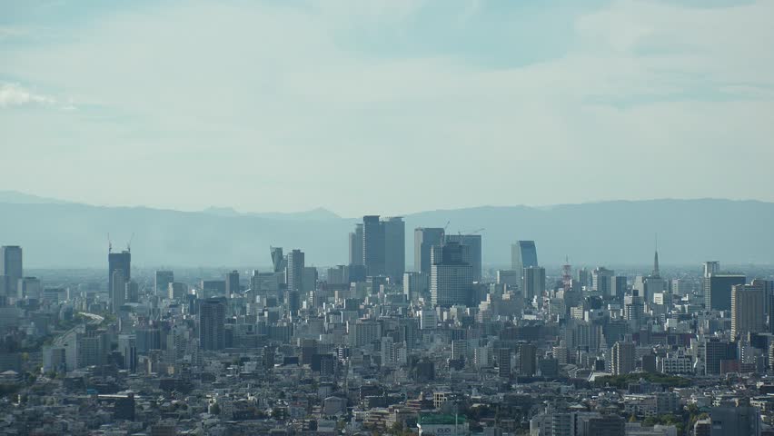 NAGOYA, JAPAN - OCTOBER 2022 : Aerial high angle view of NAGOYA CITY in sunny daytime. View of buildings and street traffic around Nagoya station and Sakae area (central downtown).