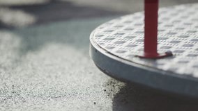 Low angle shot of children's roundabout in a playground spinning around until it stops - Powered by Shutterstock - Get 15% off with code: PIKWIZARD15