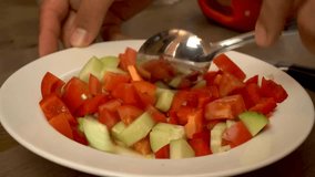 Salad preparation process. Fresh salad mixing process. Chef Mixes Vegetable Fresh Salad Food Healthy Meal Mediterranean Kitchen Vegetarian Diet. Closeup Freshness Salad. Close up. 4k video