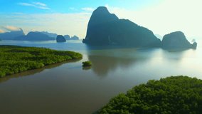 Beautiful mangroves at the estuary, many limestone mountain during sunset. (Samed Nang Chee), Phang Nga, The Most Beautiful Destinations in Southern Thailand. travel tropical concept. aerial view. 4k
