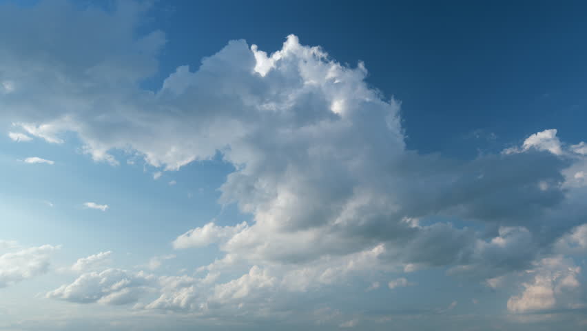 Sky with bautiful silky clouds. Puffy fluffy stratocumulus and cumulus clouds. Timelapse.