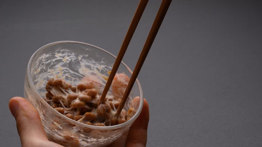 4K slow motion video with NATTO mixed in. | Shutterstock HD Video #1098706579