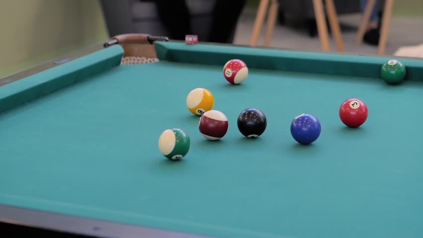 Slow motion: hitting colorful pool balls on teal billiards table at bar - close up. Sport, game, competition, hobby, leisure time concept | Shutterstock HD Video #1098706751