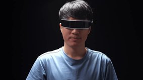 Close Up Of Asian Man Touch And Swipe Virtual Reality While Using Futuristic Goggles. Player Touching Air Panel
