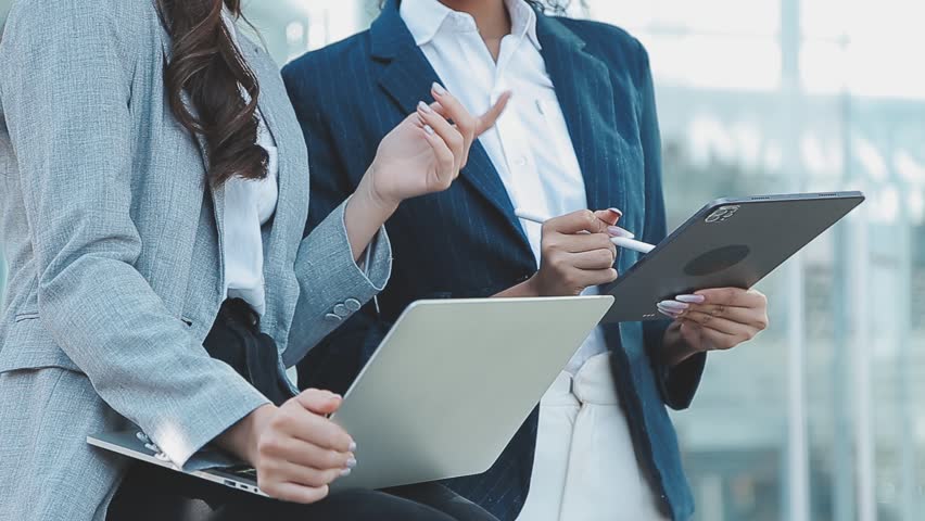 Businessman using tablet analyzing sales data and economic growth graph chart. Business strategy. Abstract icon. Digital marketing.