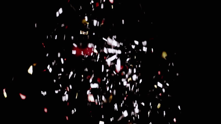 Bright, Shiny Particles of Confetti and Sequins Fall on a Black Background. Colorful shimmering, red, golden blurred spots of tinsel swirl in air. Abstract background. Christmas, New Year, birthday. | Shutterstock HD Video #1098713557