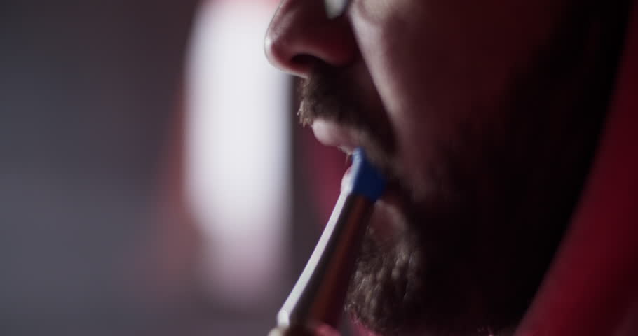 Closeup bearded guy smoking hookah in bar | Shutterstock HD Video #1098713769