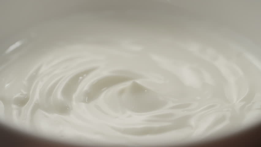 Slow motion macro shot of scooping white yogurt with a spoon | Shutterstock HD Video #1098716967