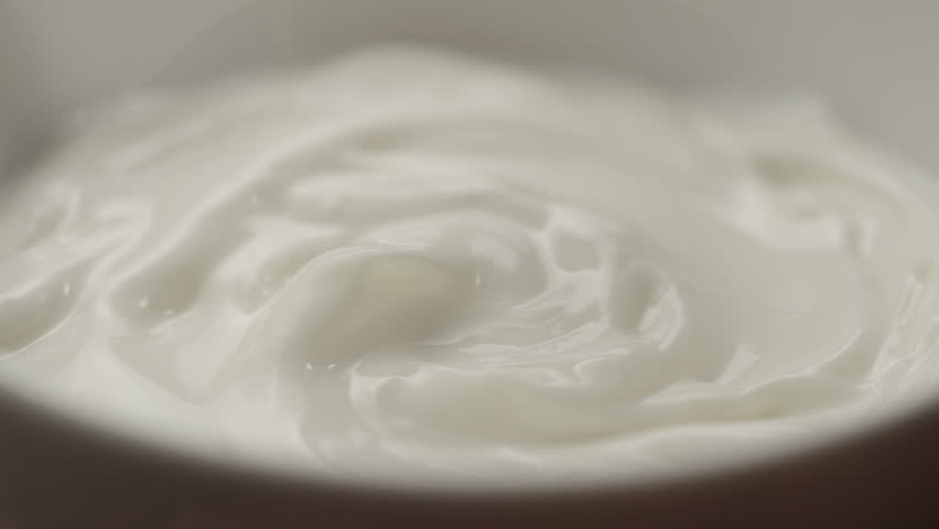 Slow motion macro shot of scooping white yogurt with a spoon | Shutterstock HD Video #1098717045